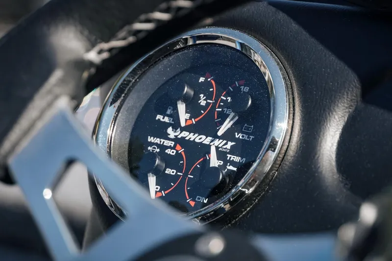 Slide: The Image of Close-up of 2026 Phoenix 721 ZXL dashboard gauges, showing fuel, volt, and trim indicators. - 10