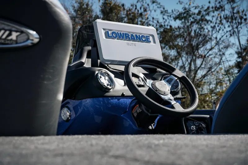 Slide: The Image of 2026 Phoenix 721 ZXL boat dashboard with Lowrance Elite display and steering wheel. - 11