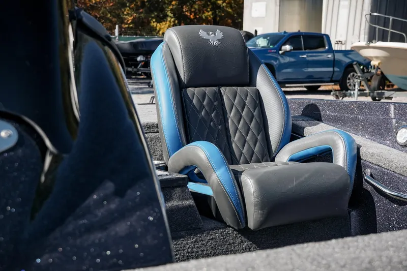 Slide: The Image of Luxurious seat in 2026 Phoenix 721 ZXL boat, featuring blue and black leather design. - 13