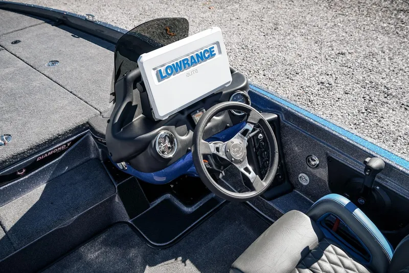 Slide: The Image of 2026 Phoenix 721 ZXL boat dashboard with Lowrance Elite display and steering wheel. - 15