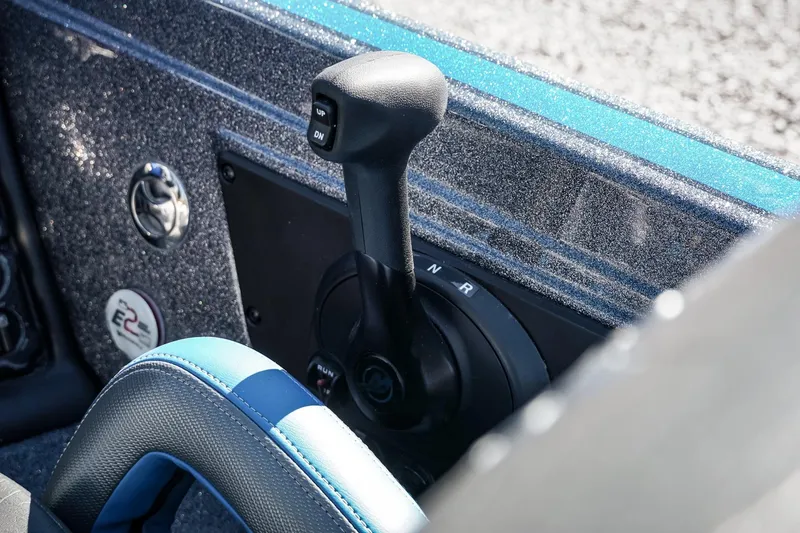 Slide: The Image of 2026 Phoenix 721 ZXL boat control panel with gear shift lever. - 16