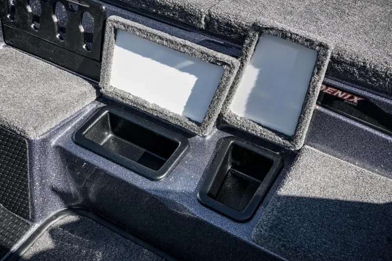 Slide: The Image of 2026 Phoenix 721 ZXL boat interior with storage compartments and carpeted surfaces. - 20
