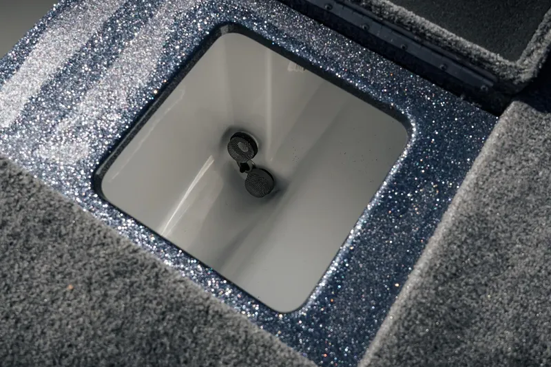Slide: The Image of Livewell compartment in 2026 Phoenix 721 ZXL boat with glittery finish. - 34
