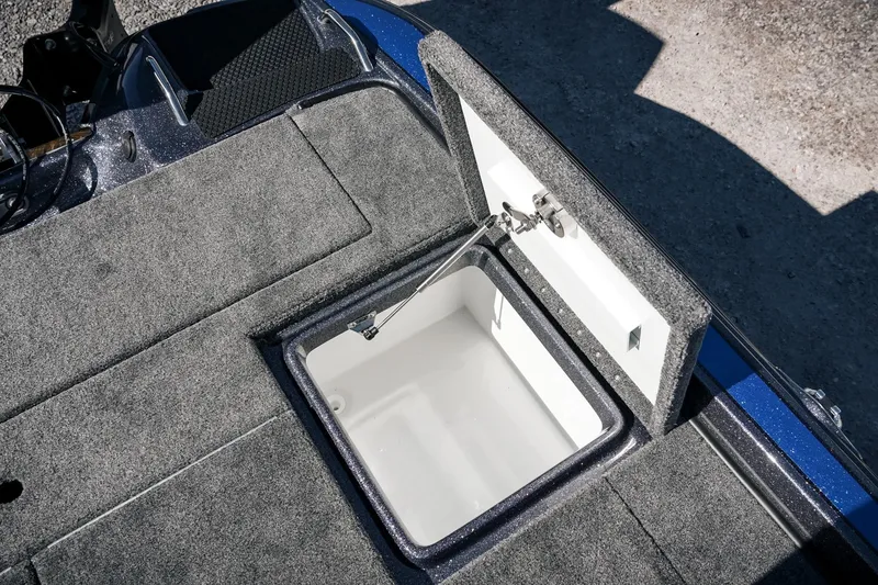 Slide: The Image of 2026 Phoenix 721 ZXL boat storage compartment with open lid, showcasing interior space. - 35