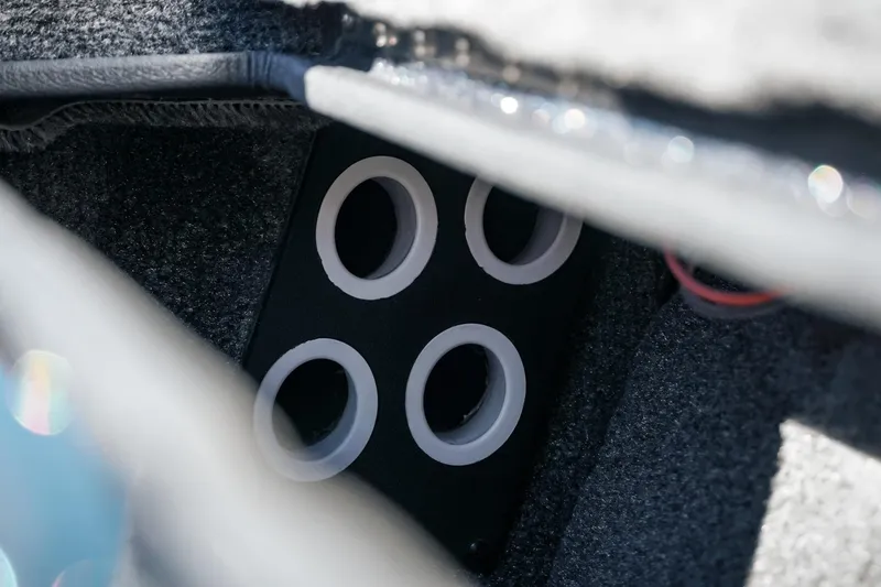 Slide: The Image of Interior view of 2026 Phoenix 721 ZXL boat storage compartment with circular holders. - 36