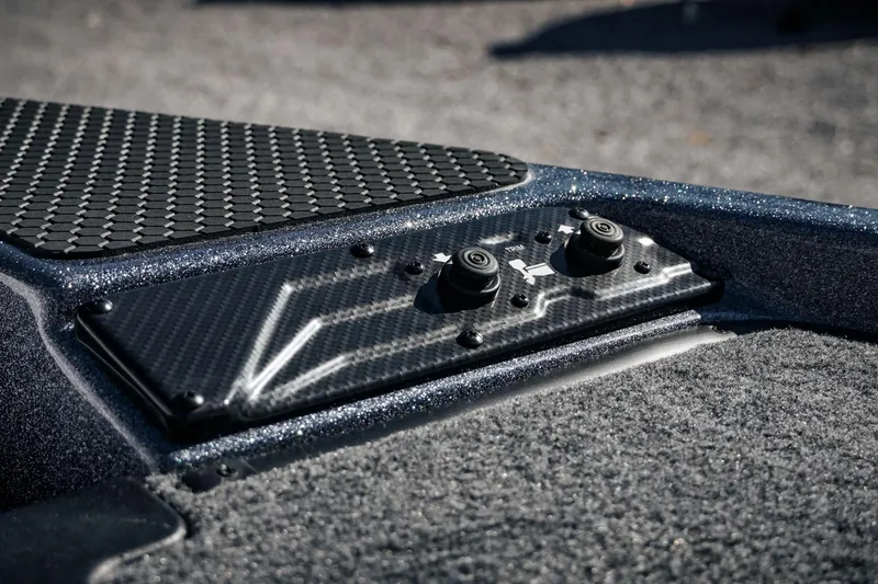 Slide: The Image of 2026 Phoenix 721 ZXL boat interior with carbon fiber control panel and textured flooring. - 38