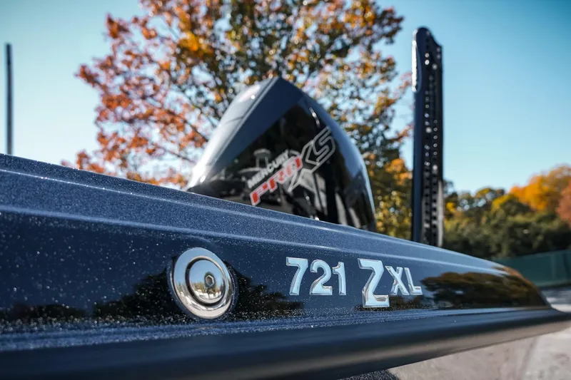 Slide: The Image of 2026 Phoenix 721 ZXL boat close-up with autumn trees in background. - 43