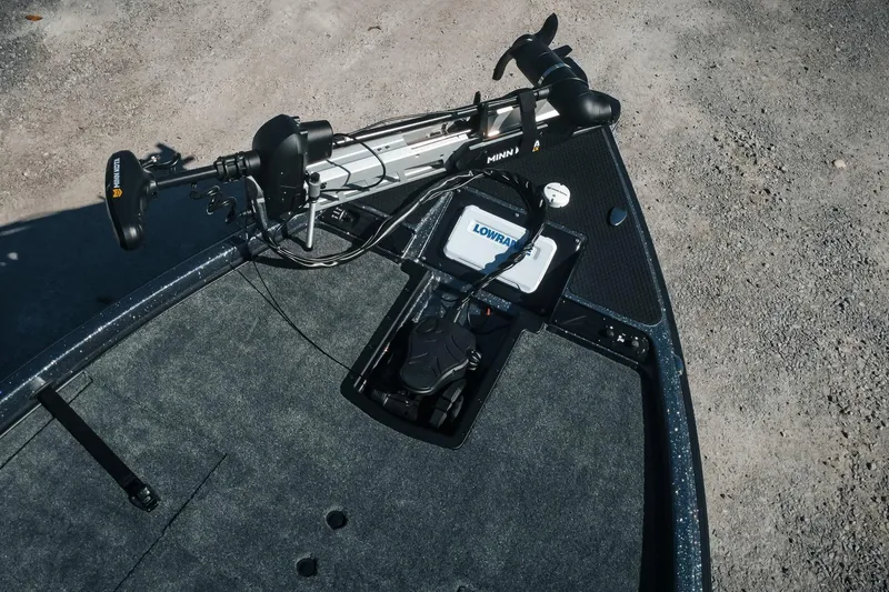 Slide: The Image of 2026 Phoenix 721 ZXL boat deck with Minn Kota trolling motor and Lowrance electronics. - 7