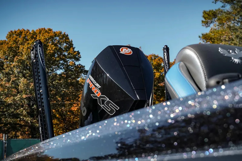 Slide: The Image of 2026 Phoenix 721 ZXL boat with Mercury Pro XS engine, autumn backdrop. - 9