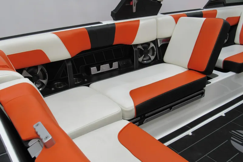 Slide: The Image of 2021 Malibu Wakesetter 24 MXZ interior with orange and white seating. - 10