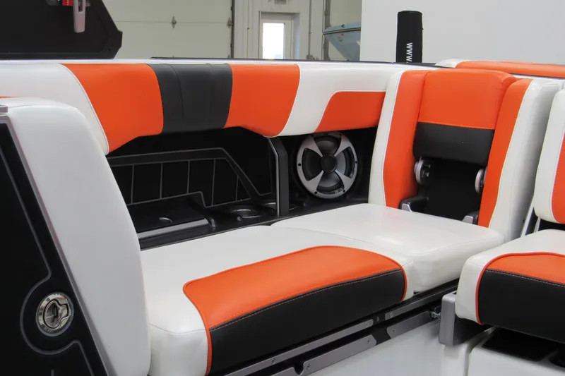 Slide: The Image of 2021 Malibu Wakesetter 24 MXZ interior with orange and white seating. - 11