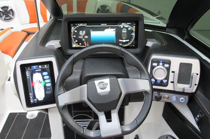 Slide: The Image of 2021 Malibu Wakesetter 24 MXZ dashboard with advanced digital controls and steering wheel. - 14