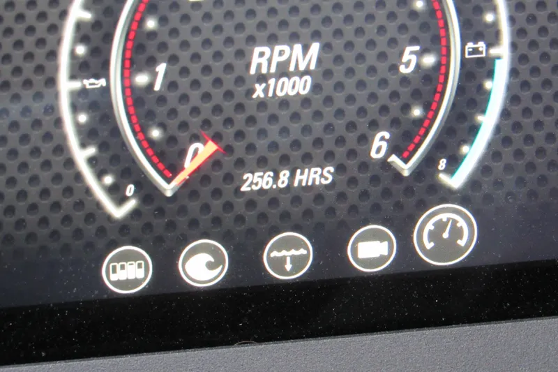Slide: The Image of Dashboard of 2021 Malibu Wakesetter 24 MXZ showing RPM and 256.8 hours usage. - 15