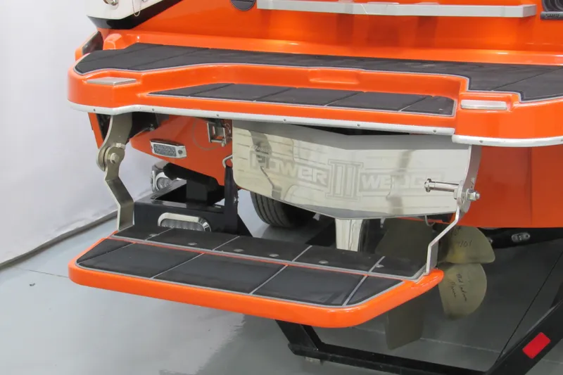 Slide: The Image of 2021 Malibu Wakesetter 24 MXZ boat stern with Power Wedge III and swim platform. - 4