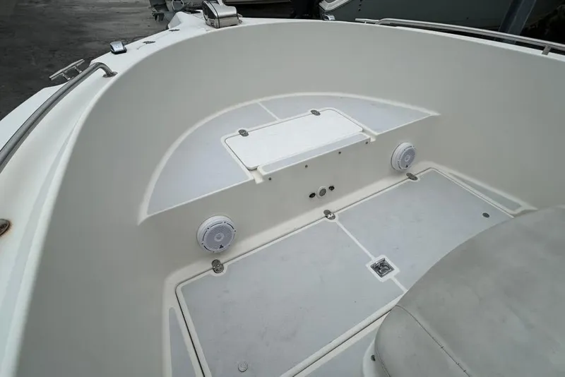 Slide: The Image of 2002 Shamrock 270 Open boat interior with seating and storage compartments. - 12