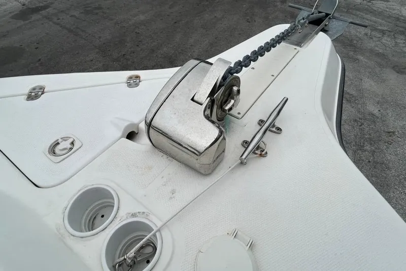 Slide: The Image of Bow of 2002 Shamrock 270 Open boat with anchor chain and cleat. - 16