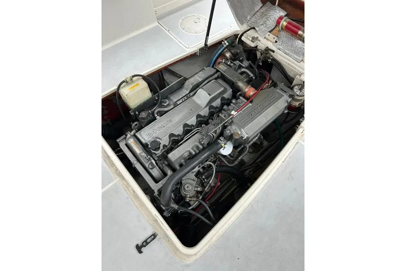 Slide: The Image of Engine compartment of a 2002 Shamrock 270 Open boat, featuring a Yanmar 24-valve engine. - 17