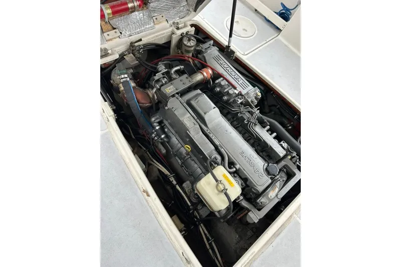 Slide: The Image of Engine compartment of a 2002 Shamrock 270 Open boat, featuring a Yanmar engine. - 18
