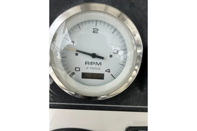 Slide: The Image of Close-up of RPM gauge on 2002 Shamrock 270 Open boat dashboard. - 19