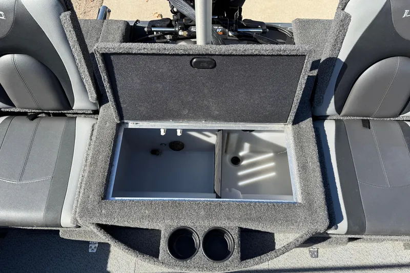 Slide: The Image of 2019 Lund 2025 Impact XS boat interior with open storage compartment and seating. - 32