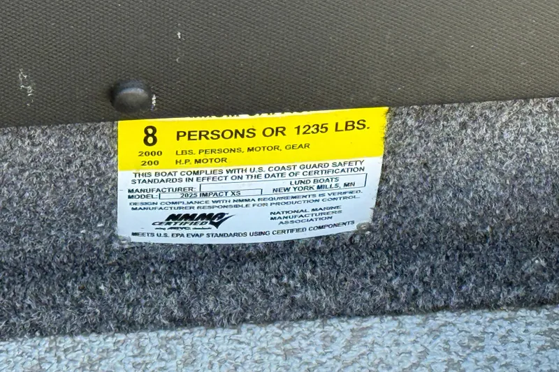 Slide: The Image of 2019 Lund 2025 Impact XS capacity label, 8 persons or 1235 lbs, 200 HP motor. - 34