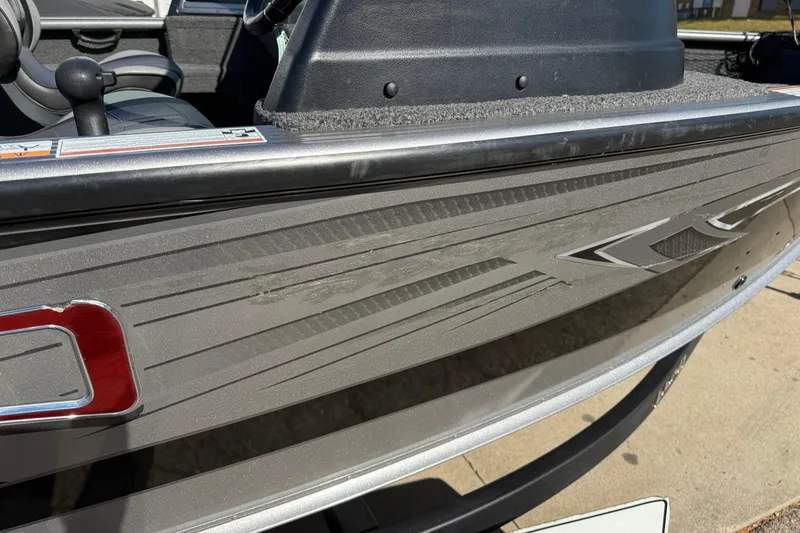 Slide: The Image of 2019 Lund 2025 Impact XS boat side view with sleek design and graphics. - 35