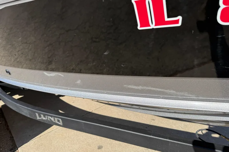 Slide: The Image of 2019 Lund 2025 Impact XS boat with visible registration number and trailer. - 36