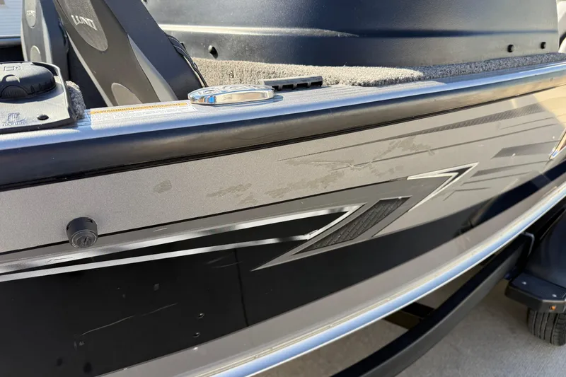 Slide: The Image of 2019 Lund 2025 Impact XS boat, close-up of sleek design and detailing. - 38