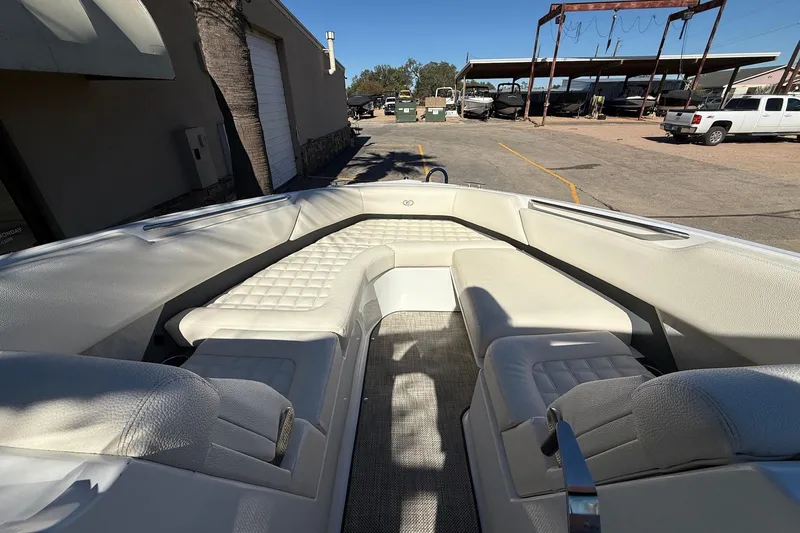 Slide: The Image of 2018 Cobalt R7 Surf boat interior with white seating and spacious layout. - 11