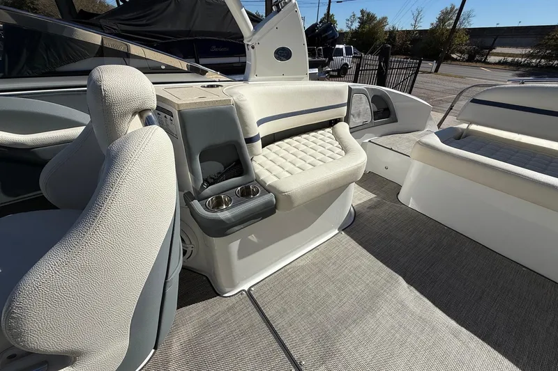 Slide: The Image of 2018 Cobalt R7 Surf boat interior with plush seating and cup holders. - 12