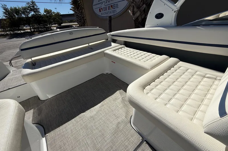 Slide: The Image of 2018 Cobalt R7 Surf boat interior with white cushioned seating and elegant design. - 13