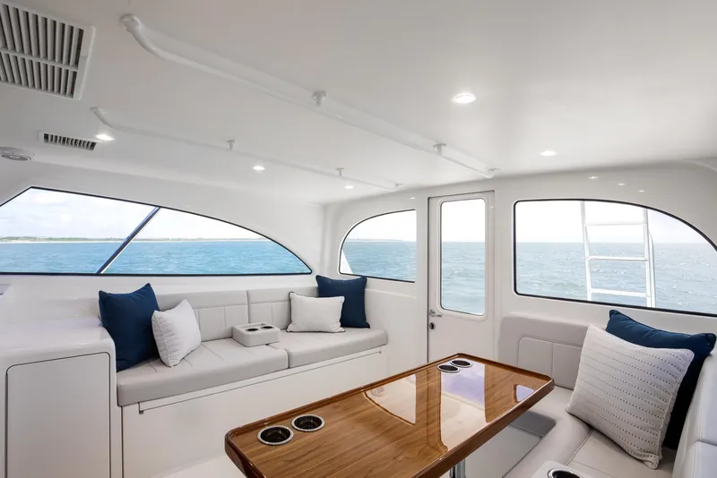 Slide: The Image of Luxurious interior of 2026 Viking 46 Billfish yacht with ocean view and plush seating. - 12