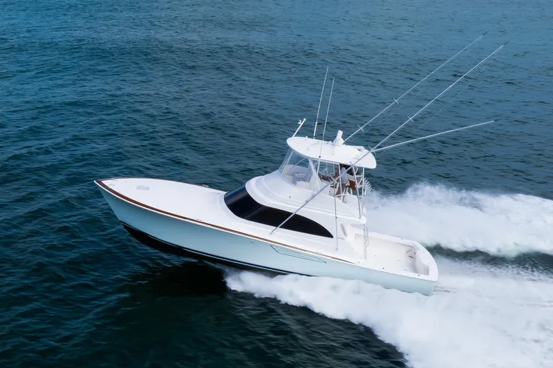 Slide: The Image of 2026 Viking 46 Billfish yacht cruising on open water. - 4