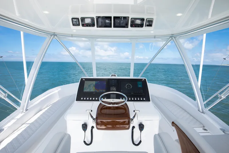 Slide: The Image of Helm of 2026 Viking 46 Billfish yacht with ocean view and modern controls. - 5