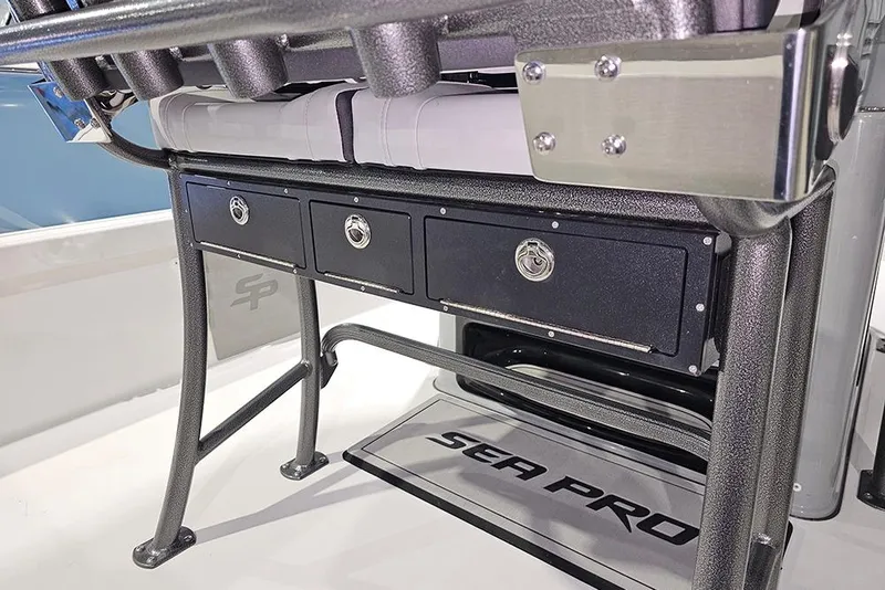 Slide: The Image of 2026 Sea Pro 250 Bay boat interior with storage compartments and seating. - 11