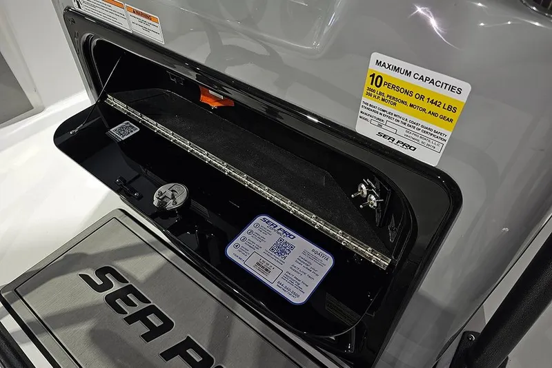 Slide: The Image of 2026 Sea Pro 250 Bay boat storage compartment with capacity label and QR code. - 15