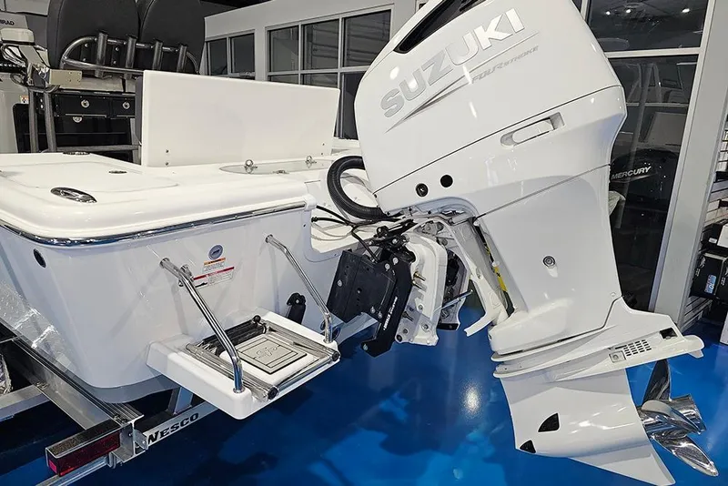 Slide: The Image of 2026 Sea Pro 250 Bay boat with Suzuki outboard motor in showroom. - 22