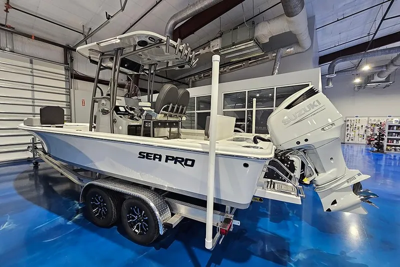 Slide: The Image of 2026 Sea Pro 250 Bay boat with Suzuki engine in showroom. - 3