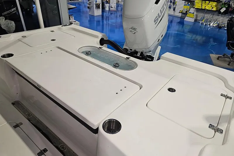 Slide: The Image of 2026 Sea Pro 250 Bay boat deck with Suzuki outboard motor in showroom. - 5