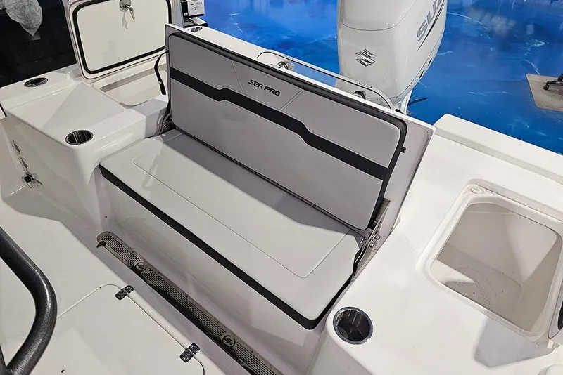 Slide: The Image of 2026 Sea Pro 250 Bay boat interior with seating and storage compartments. - 7