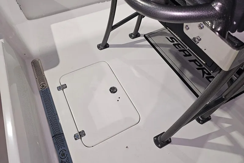 Slide: The Image of 2026 Sea Pro 250 Bay boat interior with storage hatch and seating. - 9