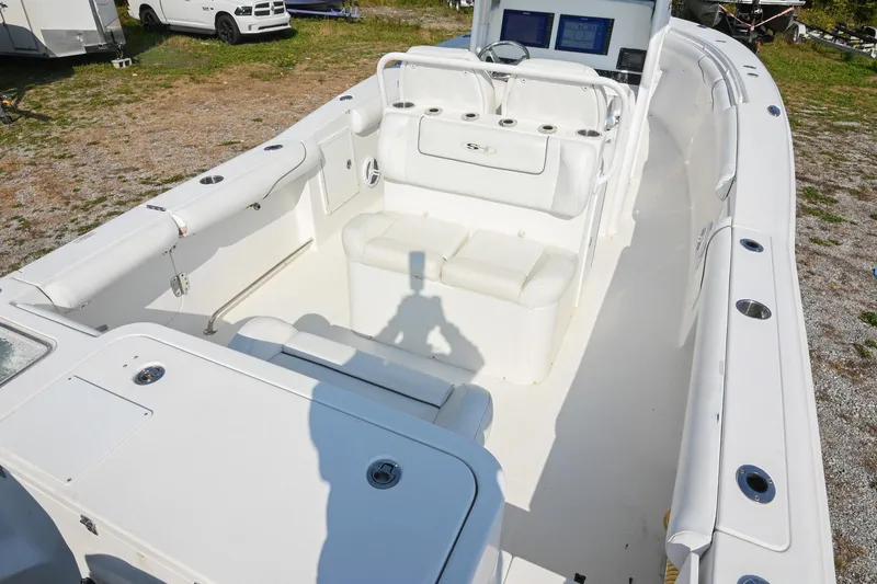 Slide: The Image of 2015 Sea Hunt Gamefish 30 boat interior with seating and control panel. - 11