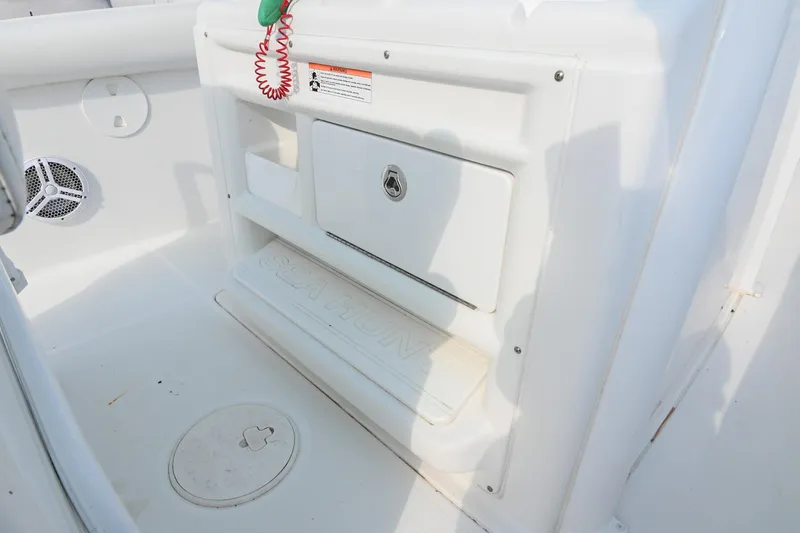 Slide: The Image of 2015 Sea Hunt Gamefish 30 interior with storage compartment and speaker. - 24