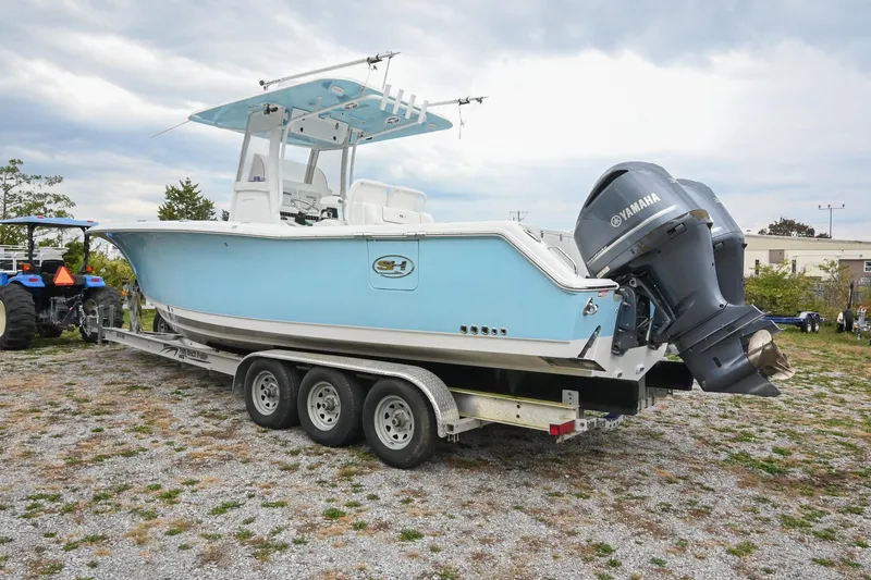 Slide: The Image of 2015 Sea Hunt Gamefish 30 boat on trailer with Yamaha outboard engines. - 3