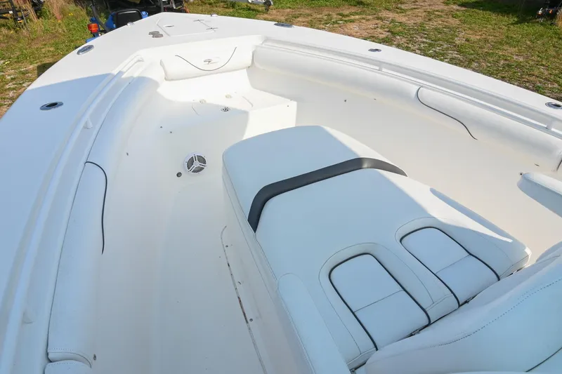 Slide: The Image of 2015 Sea Hunt Gamefish 30 boat interior with white seating and spacious deck. - 30