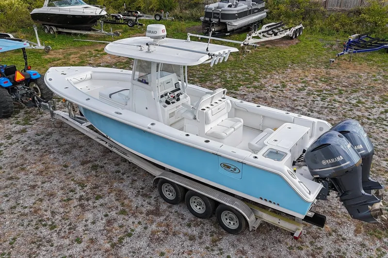 Slide: The Image of 2015 Sea Hunt Gamefish 30 boat on trailer with dual Yamaha engines. - 39