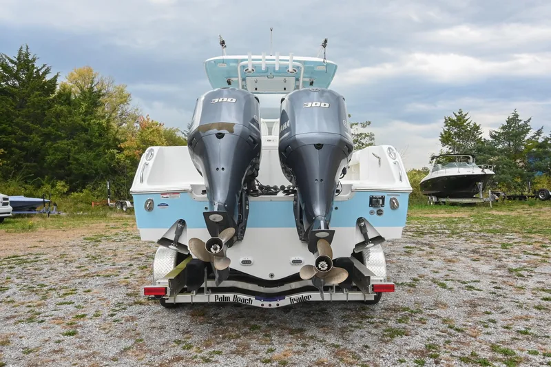 Slide: The Image of 2015 Sea Hunt Gamefish 30 with dual Yamaha 300 engines on a trailer. - 4