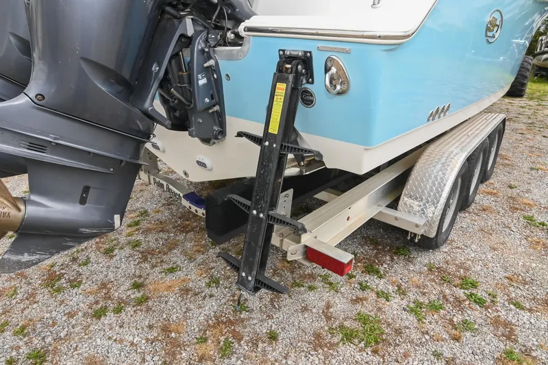 Slide: The Image of 2015 Sea Hunt Gamefish 30 boat on trailer, featuring dual outboard motors. - 9