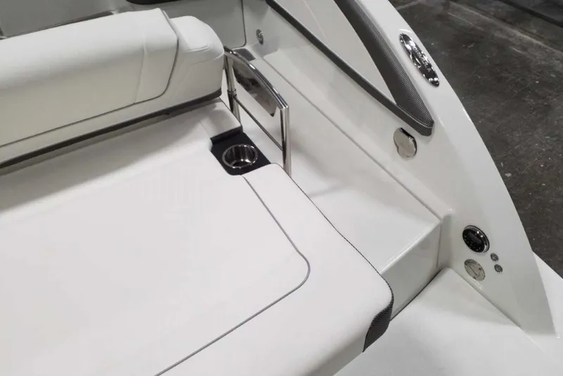 Slide: The Image of 2019 Formula 330 Crossover Bowrider in storage, covered, with swim platform and cup holders. - 10