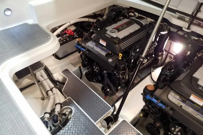 Slide: The Image of 2019 Formula 330 Crossover Bowrider with spacious white seating and sleek design. - 13